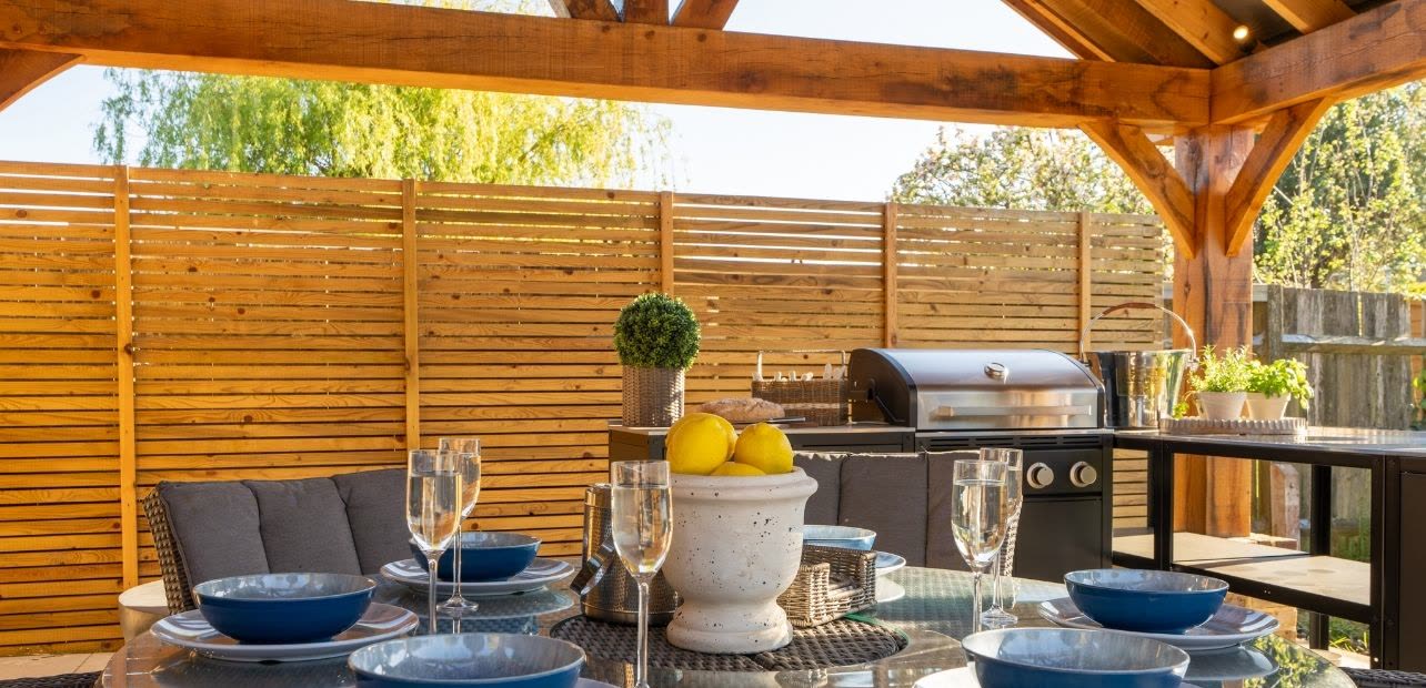 The covered outdoor kitchen and dining table